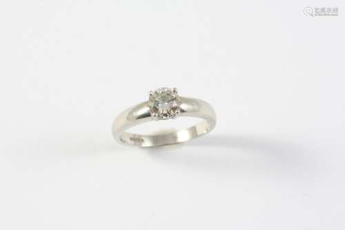 A DIAMOND SOLITAIRE RING the round brilliant-cut diamond wei...