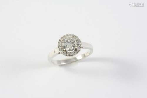 A DIAMOND CLUSTER RING the circular-cut diamond is set withi...