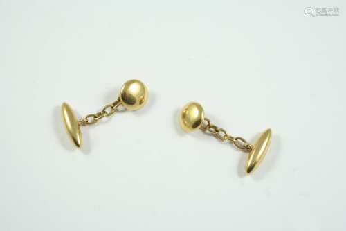 A PAIR OF 18CT GOLD CUFFLINKS each set with a circular and a...