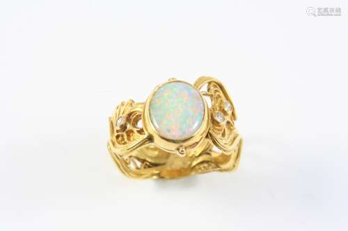 AN OPAL AND 22CT GOLD RING BY LUCY COPLESTONE the oval-shape...