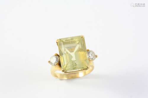 A CITRINE AND DIAMOND RING the rectangular-cut citrine is se...