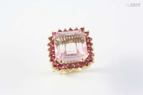 A PINK TOURMALINE AND RUBY CLUSTER RING the cut-cornered squ...