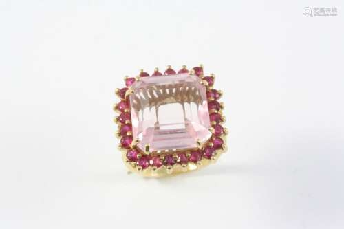 A PINK TOURMALINE AND RUBY CLUSTER RING the cut-cornered squ...