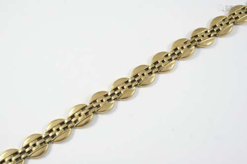 A 9CT GOLD FANCY LINK BRACELET formed with oval openwork lin...