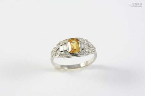 A YELLOW SAPPHIRE AND DIAMOND RING the cut cornered rectangu...