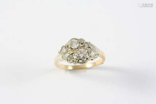A DIAMOND RING mounted with four circular-cut diamonds and t...