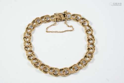 A GOLD FANCY DOUBLE CURB LINK BRACELET with concealed clasp,...