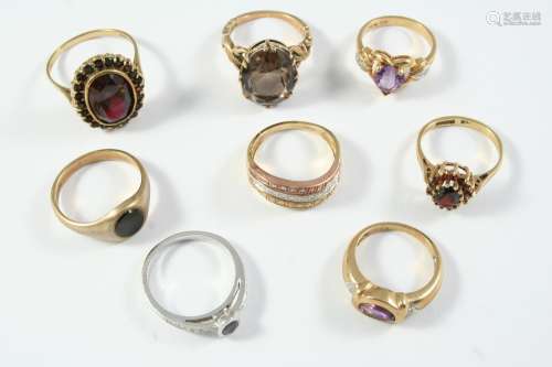 EIGHT ASSORTED GOLD AND GEM SET RINGS including a three row ...