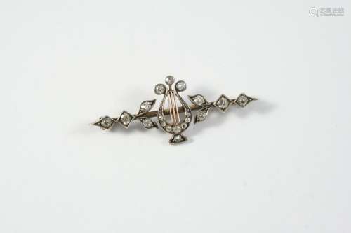 A VICTORIAN DIAMOND LYRE BROOCH set with rose-cut and old ci...