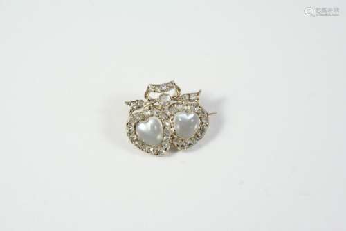 A VICTORIAN MOONSTONE AND DIAMOND DOUBLE HEART BROOCH the tw...