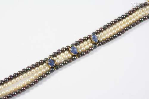 A CULTURED PEARL AND SAPPHIRE BRACELET formed with two rows ...