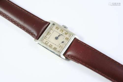 AN ART DECO SILVER WRISTWATCH the square shaped dial with Ar...