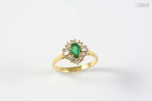 AN EMERALD AND DIAMOND CLUSTER RING the pear-shaped emerald ...