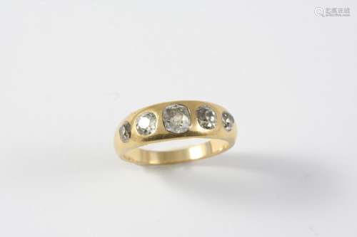 A DIAMOND FIVE STONE RING the yellow gold band is mounted wi...