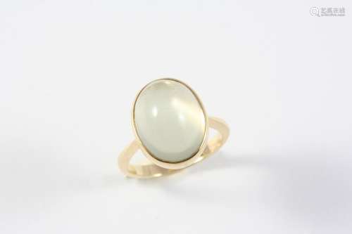 A MOONSTONE SINGLE STONE RING mounted with an oval cabochon ...