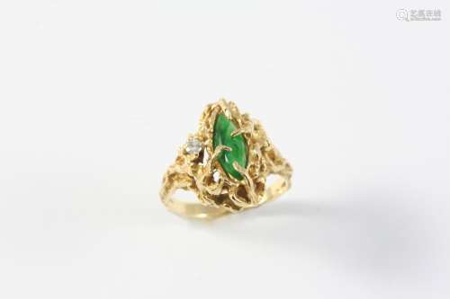 A JADE AND DIAMOND RING the marquise-shaped jade is set with...
