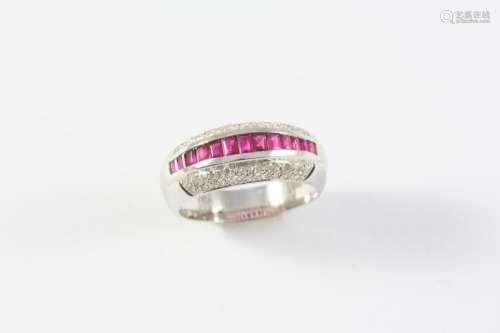 A RUBY AND DIAMOND HALF HOOP RING the central line of calibr...