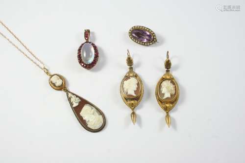 A MOONSTONE AND GARNET CLUSTER PENDANT the oval shaped caboc...