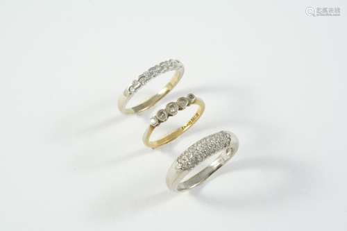 A DIAMOND HALF HOOP RING set with staggered circular-cut dia...