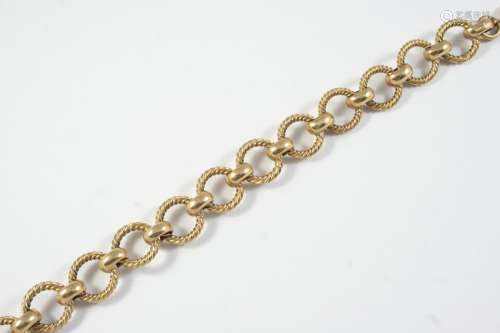 A 9CT GOLD BRACELET formed with rope style circular links an...