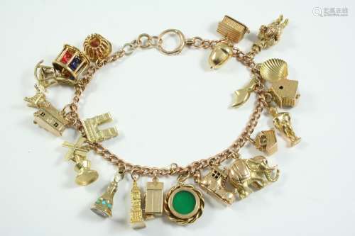 A 9CT GOLD CURB LINK CHARM BRACELET each link stamped 375, s...