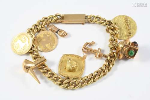 A GOLD ENGRAVED CURB LINK BRACELET with concealed clasp, and...