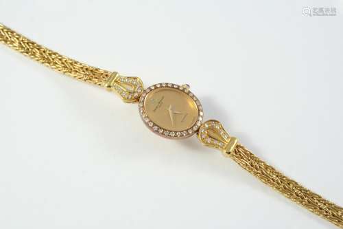 A LADY'S DIAMOND AND 18CT GOLD WRISTWATCH BY BAUME & MERCIER...