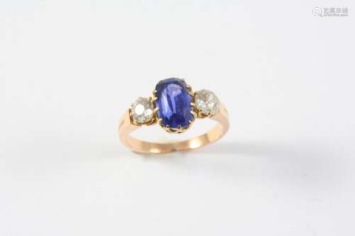A SAPPHIRE AND DIAMOND THREE STONE RING the oval-shaped sapp...