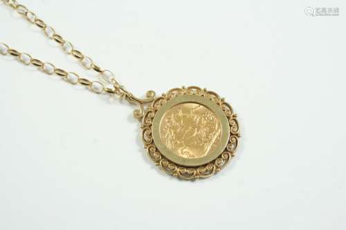 A GOLD SOVEREIGN 1915, in a 9ct gold ornate pendant mount, o...