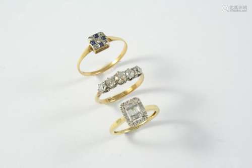A DIAMOND CLUSTER RING centred with three baguette-cut diamo...