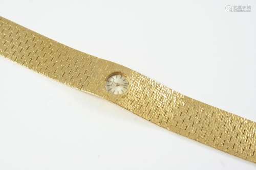 A LADY'S GOLD WRISTWATCH BY BUECHE-GIROD the signed circular...