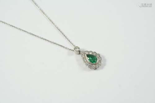 AN EMERALD AND DIAMOND CLUSTER PENDANT the pear-shaped emera...