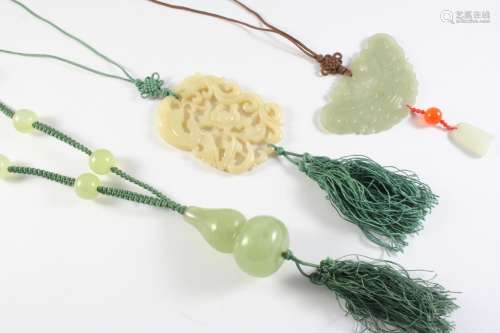 A CARVED JADE PENDANT of bird and foliate decoration, 6.5cm ...