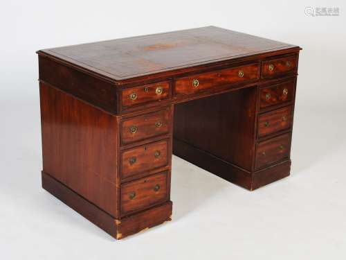 A 19th century mahogany pedestal desk, the rectangular top w...