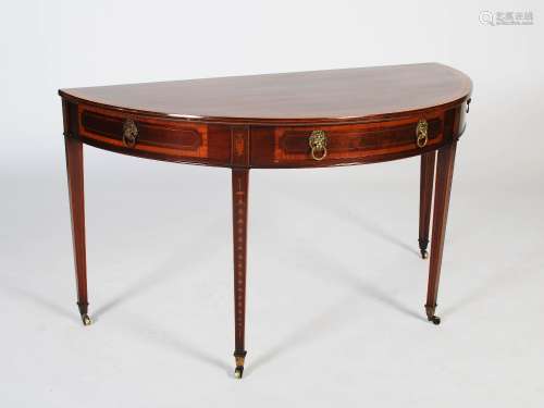 A 19th century mahogany and marquetry inlaid demi lune conso...