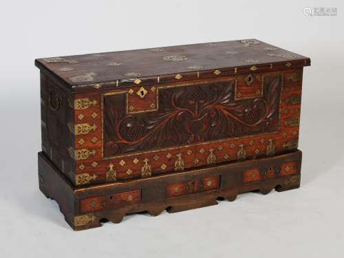 A 19th century Anglo-Indian brass bound chest on stand, the ...