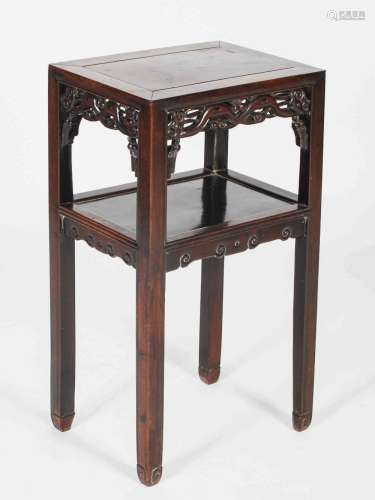 A Chinese dark wood urn stand, Qing Dynasty, the rectangular...