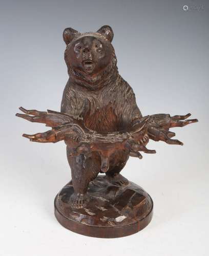 A late 19th/ early 20th century Black Forest carved bear pip...