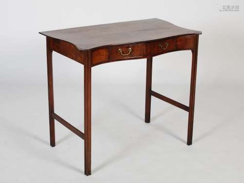 A 19th century mahogany serpentine side table in George III ...