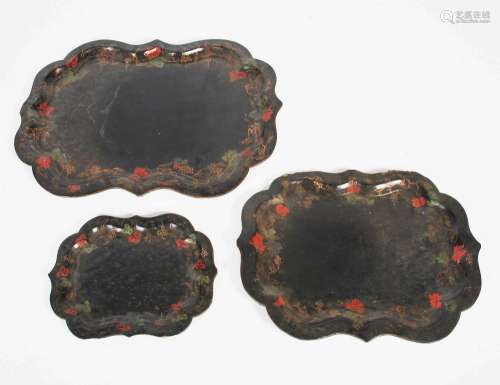 A graduated set of three 19th century papier mache trays, th...