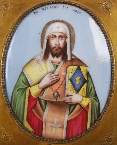 A 19th century Russian icon, of oval convex form, polychrome...