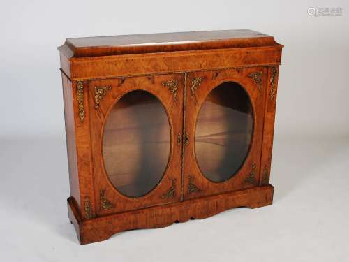 A Victorian walnut and gilt metal mounted credenza, the rect...