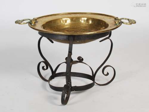 A late 19th century Eastern brass two-handled bowl on wrough...