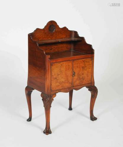 An early 20th century walnut side cabinet, the rectangular t...