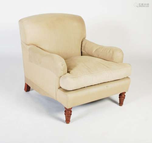 A 20th century club armchair in the style of Howard & Sons, ...