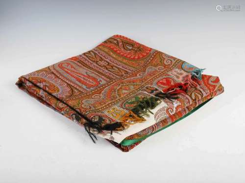 A large late 19th century Paisley shawl, centred with an off...