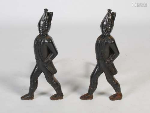 A pair of early 20th century cast iron andirons in the form ...