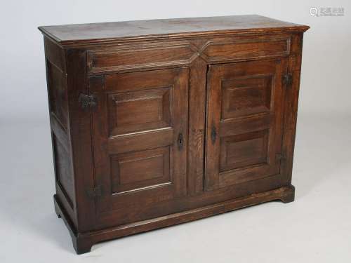 A 19th century oak side cabinet, the rectangular top with mo...