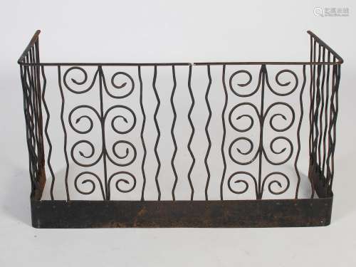 An Arts & Crafts wrought iron nursery fire guard, with two s...