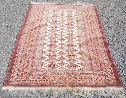 A Persian rug, late 19th/ early 20th century, the off-white ...